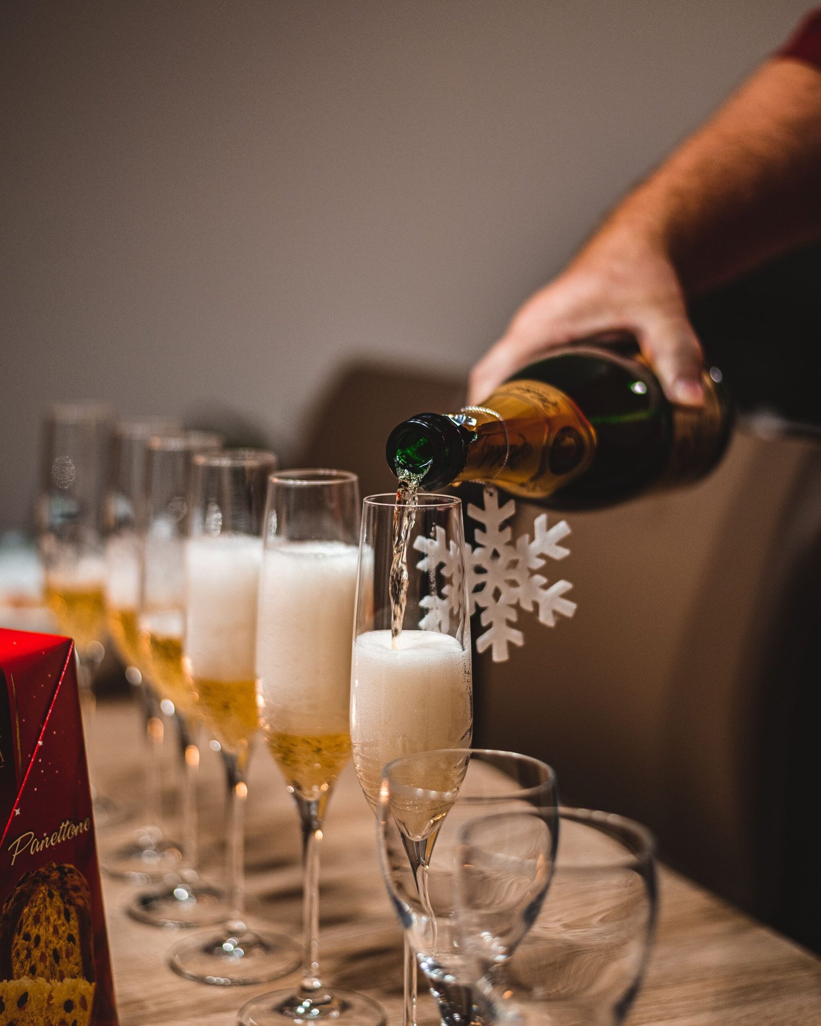 Hand Filling The Glasses With Champagne On The New Year's Eve