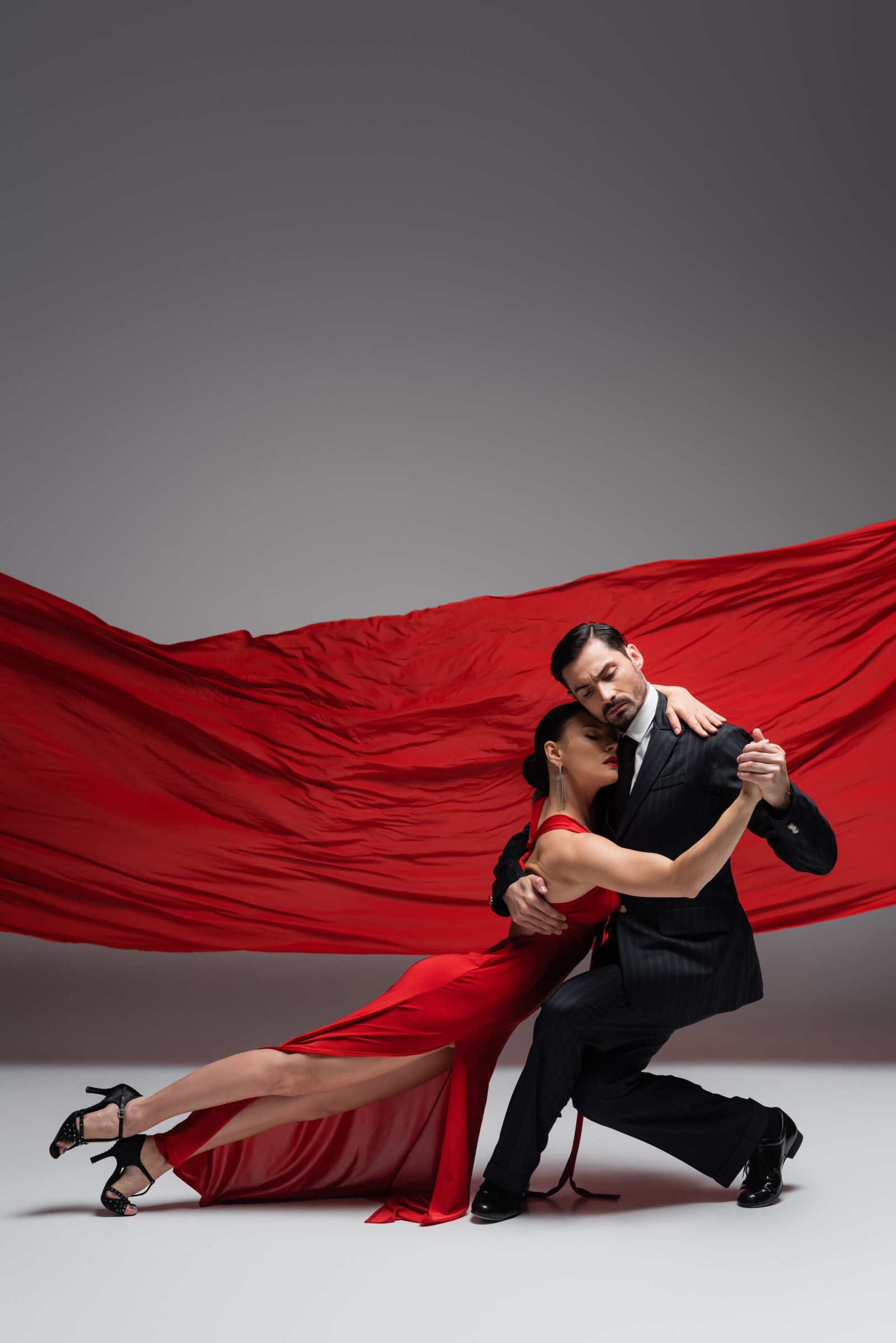 Dance Ballroom Couple In Gold Dress Dancing On Studio Background.